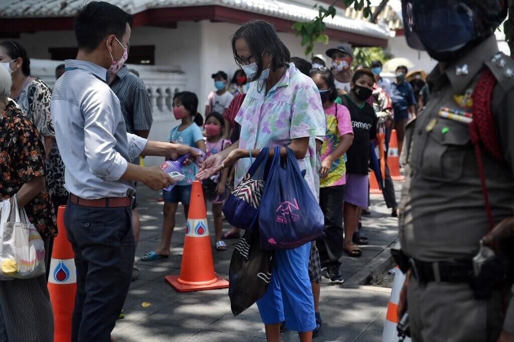 Jobless Thais queue for food as pandemic hits economy